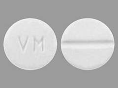 This is a white round Tablet imprinted with VM on the front, nothing on the back, and is manufactured by AIPING PHARMACE.