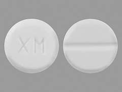 This is a white round Tablet imprinted with XM on the front, nothing on the back, and is manufactured by AIPING PHARMACE.