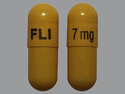 Memantine Hcl Er: Esto es un Cápsula Para Rociar Er 24 Hr imprimido con FLI 7 mg en la parte delantera, nada en la parte posterior, y es fabricado por None.