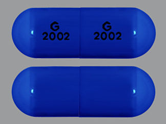 This is a Capsule imprinted with G  2002 on the front, G  2002 on the back.