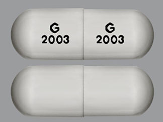 This is a Capsule imprinted with G  2003 on the front, G  2003 on the back.