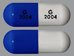 Esto es un Cápsula imprimido con G 2004 en la parte delantera, G 2004 en la parte posterior, y es fabricado por None.