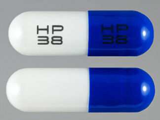 This is a Capsule imprinted with HP  38 on the front, HP  38 on the back.