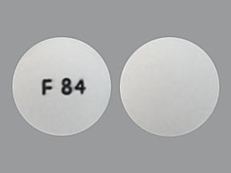 Esto es un Tableta imprimido con F 84 en la parte delantera, nada en la parte posterior, y es fabricado por None.