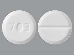 Esto es un Tableta blanco redondo imprimido con 703 en la parte delantera, nada en la parte posterior, y es fabricado por AVET PHARMACEUT.