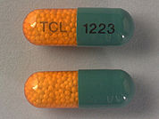 Nitro-Time: This is a Capsule Er imprinted with TCL on the front, 1223 on the back.