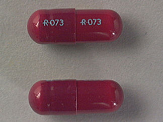 This is a Capsule imprinted with logo and 073 on the front, logo and 073 on the back.