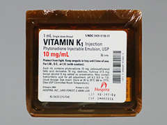 This is a yellow Ampul imprinted with nothing on the front, nothing on the back, and is manufactured by HOSPIRA/PFIZER.