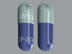 This is a light green oblong Capsule imprinted with 18mg on the front, IP-203 on the back, and is manufactured by EGALET/ZYLA LIF.