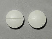 Vitamin C: This is a white round Tablet imprinted with nothing on the front, nothing on the back, and is manufactured by GERI-CARE.