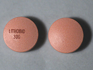 This is a Tablet Er imprinted with LITHOBID  300 on the front, nothing on the back.