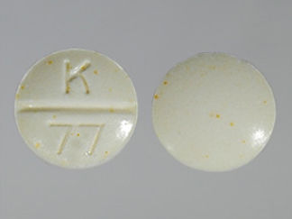 This is a Tablet imprinted with K  77 on the front, nothing on the back.