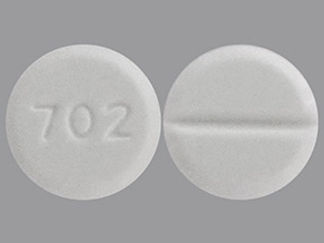 This is a Tablet Dose Pack imprinted with 702 on the front, nothing on the back.