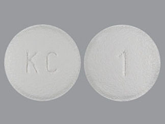 This is a Tablet imprinted with KC on the front, 1 on the back.