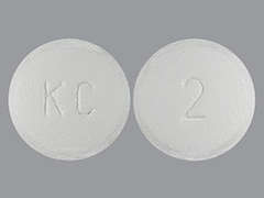 This is a white round Tablet imprinted with KC on the front, 2 on the back, and is manufactured by KOWA PHARMACEUT.