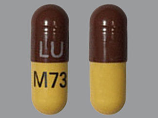 This is a Capsule imprinted with LU on the front, M73 on the back.