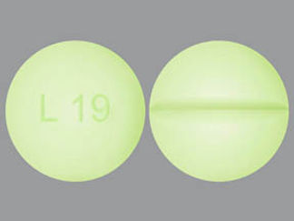 This is a Tablet imprinted with L 19 on the front, nothing on the back.