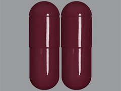This is a maroon oblong Capsule imprinted with nothing on the front, nothing on the back, and is manufactured by MACLEODS PHARMA.