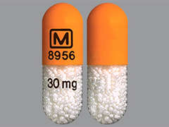 This is a orange oblong Capsule Er 24 Hr imprinted with logo and 8956 on the front, 30 mg on the back, and is manufactured by MALLINCK-SPECGX.