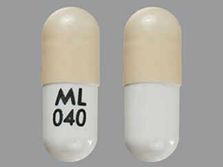 This is a Capsule imprinted with ML  040 on the front, nothing on the back.