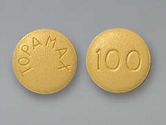 Esto es un Tableta amarillo redondo imprimido con TOPAMAX en la parte delantera, 100 en la parte posterior, y es fabricado por JANSSEN PHARM..