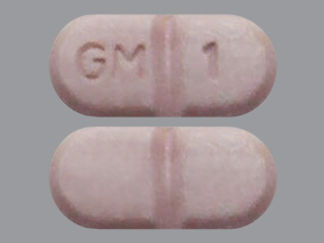 This is a Tablet imprinted with GM 1 on the front, nothing on the back.
