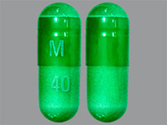 This is a green oblong Capsule imprinted with M on the front, 40 on the back, and is manufactured by MICRO LABS USA,.