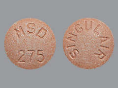 Esto es un Tableta Masticable rosado redondo imprimido con MSD  275 en la parte delantera, SINGULAIR en la parte posterior, y es fabricado por ORGANON LLC.