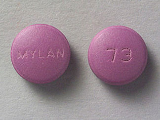 This is a Tablet imprinted with MYLAN on the front, 73 on the back.