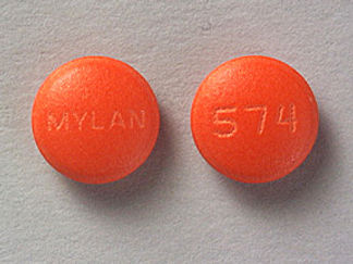 Esto es un Tableta imprimido con MYLAN en la parte delantera, 574 en la parte posterior, y es fabricado por None.