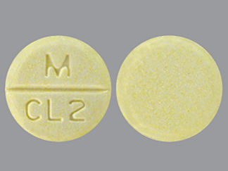 Esto es un Tableta imprimido con M  CL2 en la parte delantera, nada en la parte posterior, y es fabricado por None.