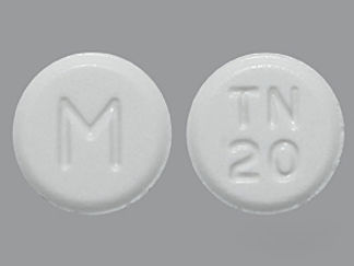 This is a Tablet imprinted with M on the front, TN  20 on the back.