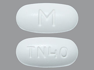 Esto es un Tableta imprimido con M en la parte delantera, TN40 en la parte posterior, y es fabricado por None.