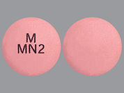 Metformin Hcl Er: Esto es un Tableta Er 24 Hr imprimido con M  MN2 en la parte delantera, nada en la parte posterior, y es fabricado por None.