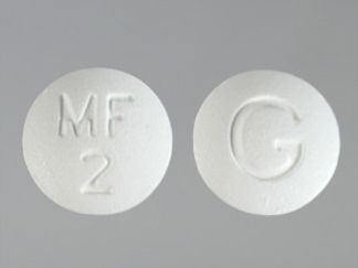 This is a Tablet imprinted with MF  2 on the front, G on the back.