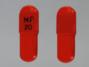 Piroxicam: This is a Capsule imprinted with NP  20 on the front, nothing on the back.