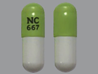 This is a Capsule imprinted with NC  667 on the front, nothing on the back.