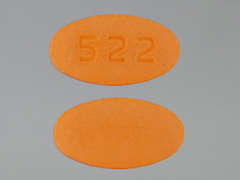 Esto es un Tableta naranja elíptico imprimido con 522 en la parte delantera, nada en la parte posterior, y es fabricado por ORCHID/BIONPHAR.