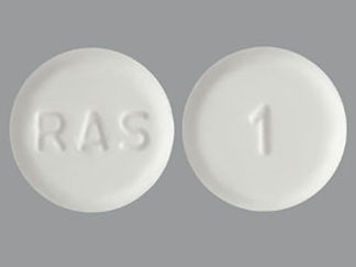 This is a Tablet imprinted with RAS on the front, 1 on the back.