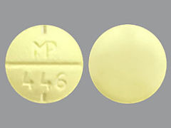 This is a yellow round Tablet imprinted with MP  446 on the front, nothing on the back, and is manufactured by SUN PHARMACEUTI.