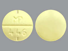 This is a yellow round Tablet imprinted with MP  446 on the front, nothing on the back, and is manufactured by SUN PHARMACEUTI.