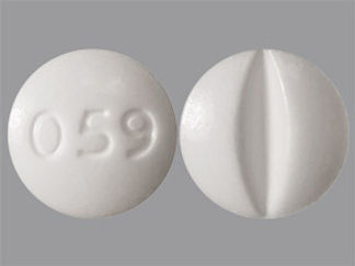 This is a Tablet Dose Pack imprinted with 059 on the front, nothing on the back.