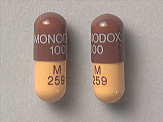 This is a Capsule imprinted with MONODOX  100 on the front, M  259 on the back.