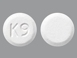 This is a Tablet Disintegrating imprinted with K9 on the front, nothing on the back.