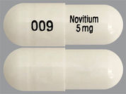 Nitisinone: Esto es un Cápsula imprimido con 009 en la parte delantera, Novitium  5 mg en la parte posterior, y es fabricado por None.