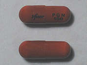 Lyrica: Esto es un Cápsula naranja oblongo imprimido con Pfizer en la parte delantera, PGN  100 en la parte posterior, y es fabricado por PFIZER/VIATRIS.