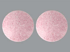 This is a pink round Tablet imprinted with nothing on the front, nothing on the back, and is manufactured by PHARMAVITE.