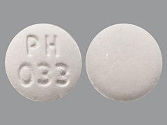 This is a Tablet imprinted with PH  033 on the front, nothing on the back.