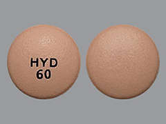 This is a beige round Tablet Oral Only Er 24 Hr imprinted with HYD  60 on the front, nothing on the back, and is manufactured by PURDUE PHARMA L.