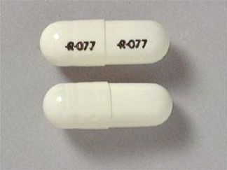 This is a Capsule imprinted with logo and 077 on the front, logo and 077 on the back.